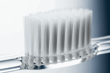 Do Harder Toothbrush Bristles Clean Better?